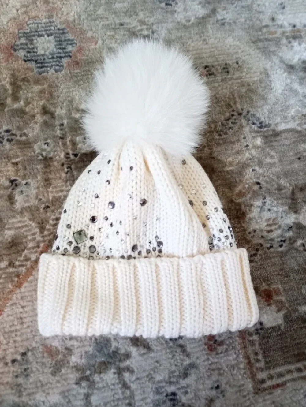 Regina Pour OG Italian cream color knit wool beanie with a real fur pom pom